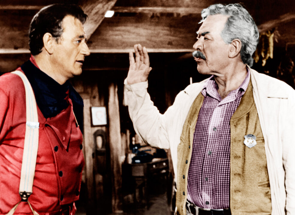 THE SEARCHERS, from left: John Wayne, Ward Bond, 1956
