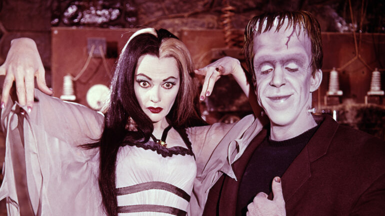 Pictured from left is Yvonne De Carlo (as Lily Munster), Fred Gwynne (as Herman Munster) in the CBS series, THE MUNSTERS. Premier episode aired September 24, 1964.