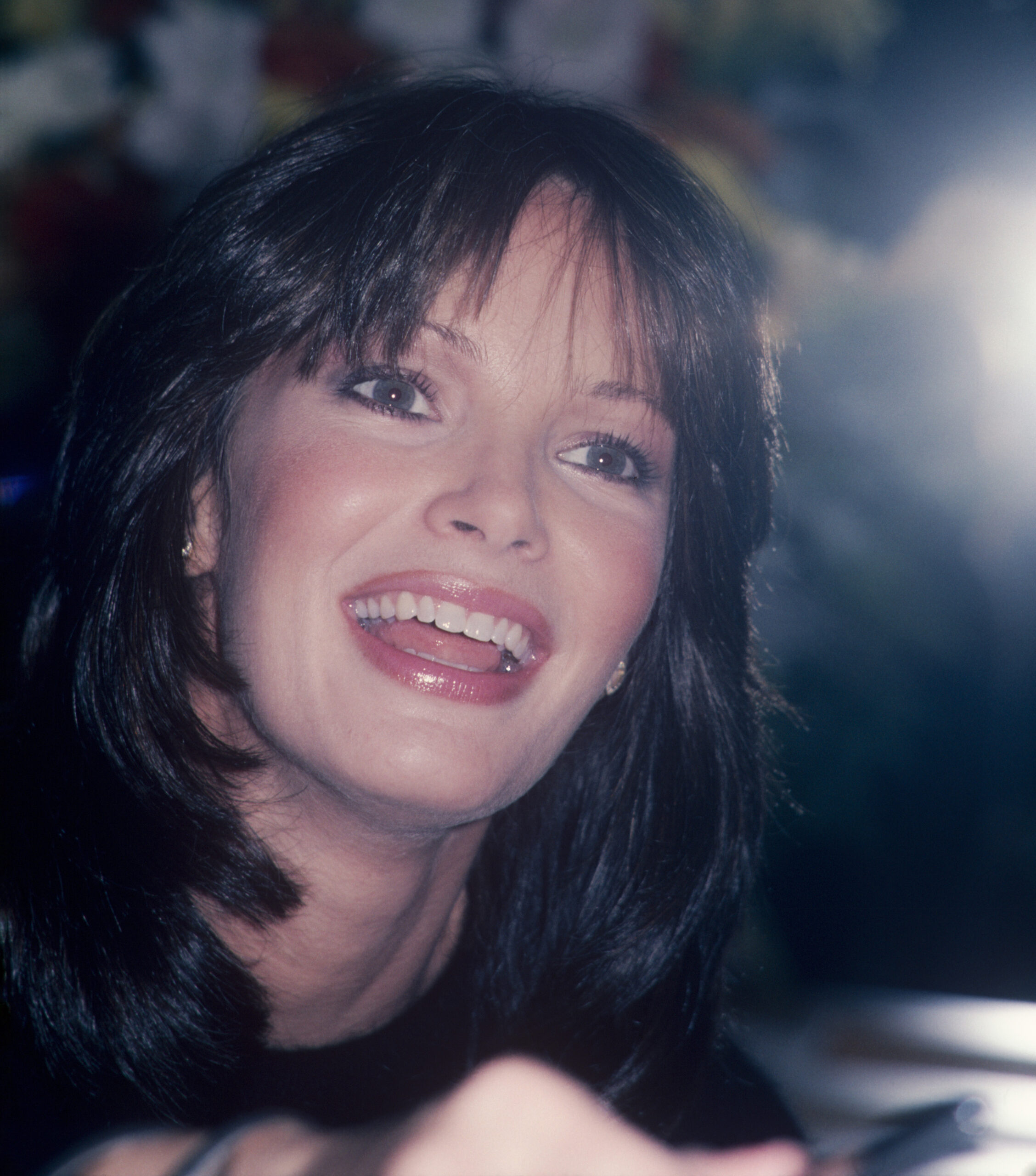 Jaclyn Smith close-up smiling; circa 1970; New York.