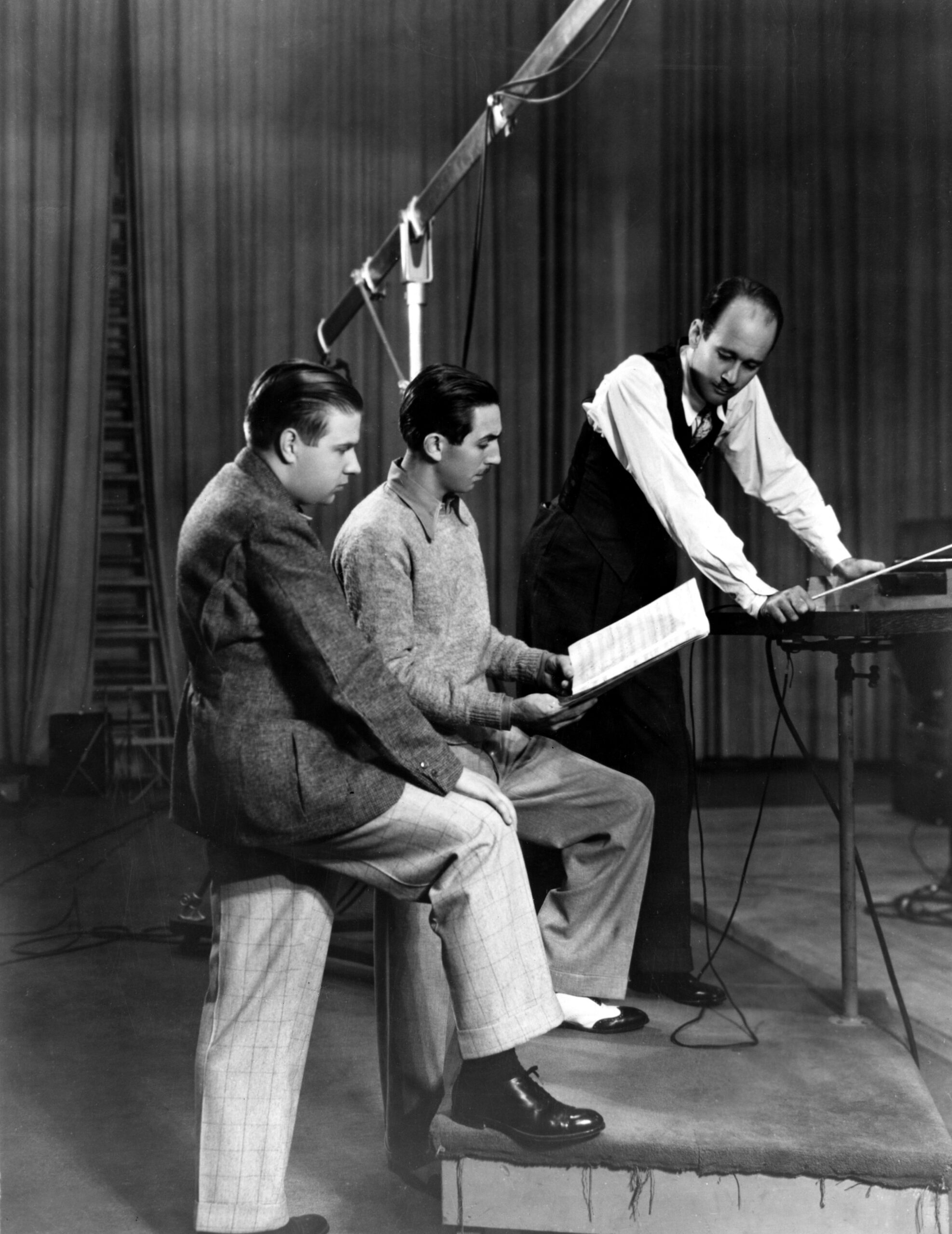 Walt Disney (center ) with musical director Carl Stalling (right) in the early 1930s
